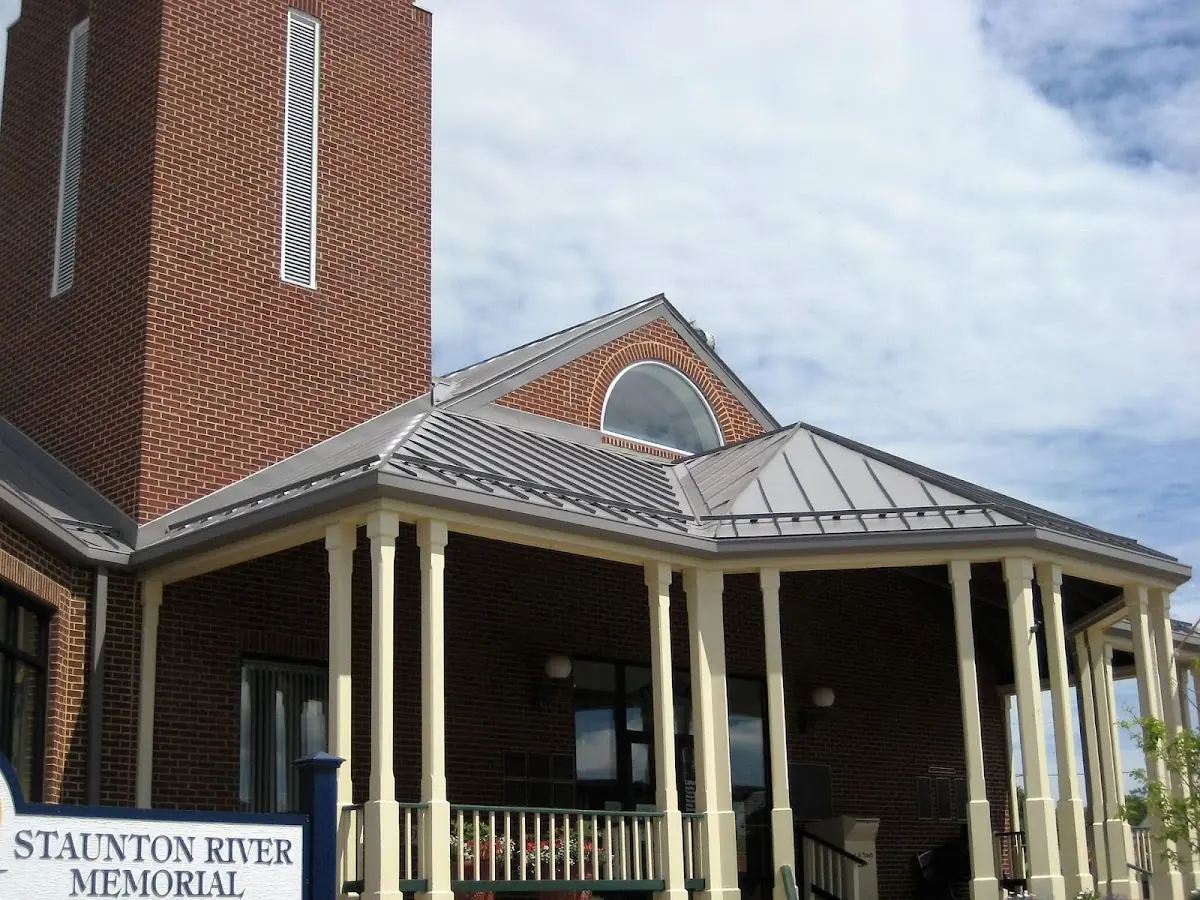 Skilled roofing craftsmen working on a residential roof in Queens Chapel Manor
